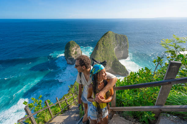istock A couple standing together while admiring an inspiring coastal and ocean view. 2206487897