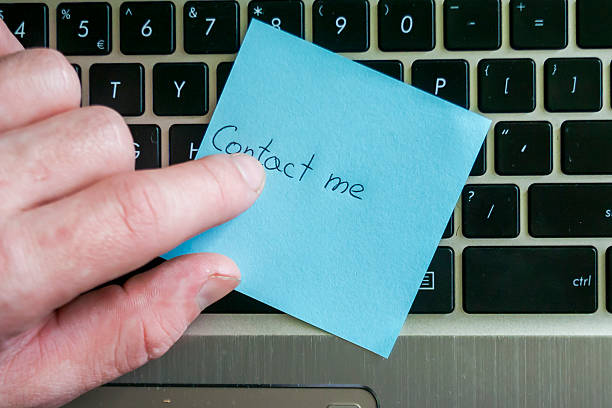 istock A hand placing a sticky note with 