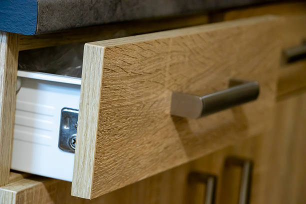 istock Close-up of a modern kitchen drawer with a wooden finish and sleek handle, emphasizing elegance and functionality in home decor 2206491019