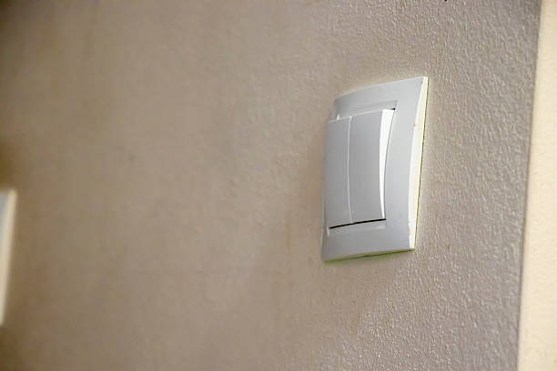 Hand presses the door opening button