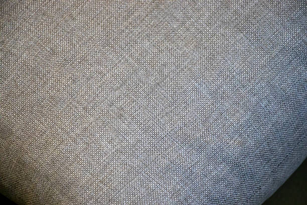 istock Close-up of a textured gray fabric, ideal for design and textile applications. Subtle weave creates a sophisticated atmosphere for interior decor. 2206492333