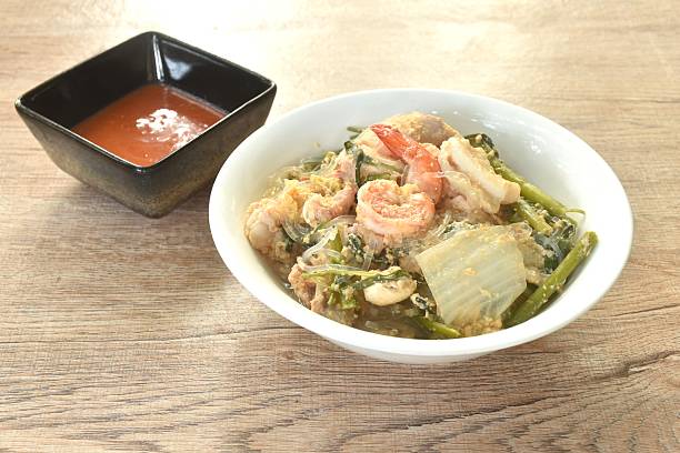 boiled sukiyaki seafood chicken and pork meat couple crispy pickled squid and shrimp with vegetable in soup dipping sauce