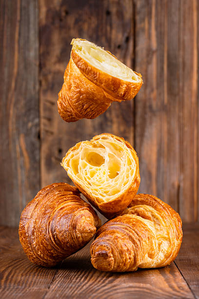 istock Delicious snack croissant on wooden background 2206496325