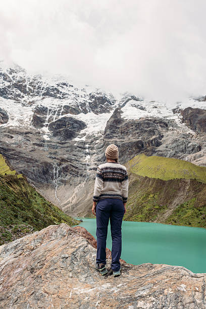 istock Hiker Admiring Scenic Mountain Lake View 2206496510