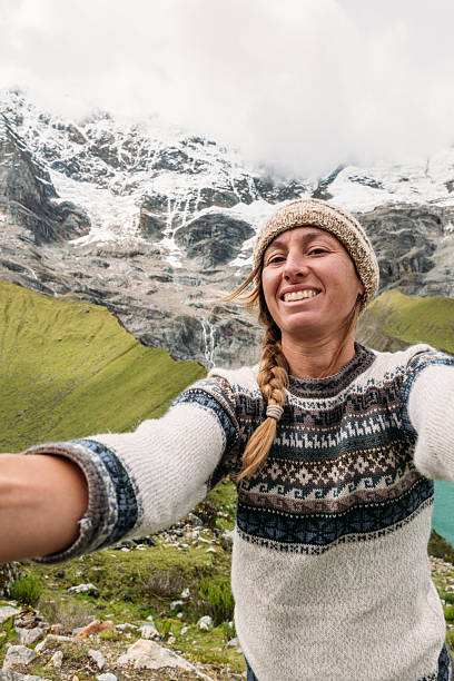 istock Woman Taking Selfie with Scenic Mountain Landscape 2206496566