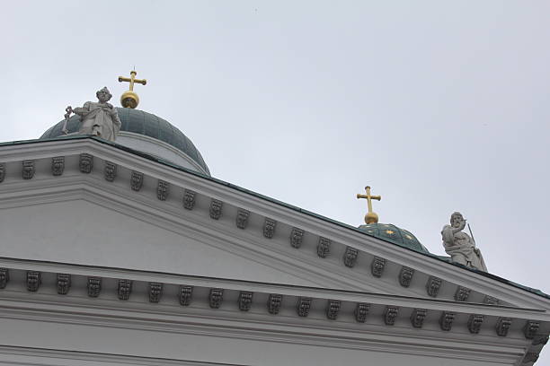 Roof Corner of Helsinki Cathedral with two statues and two golden crosses