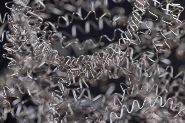 bent metal wire closeup, old curved heating wire made of metal