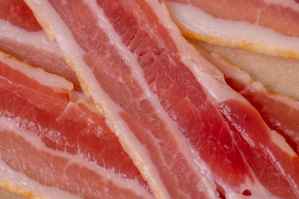 istock fresh thinly sliced pork bacon with meat and bacon 2206504182