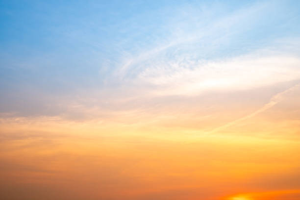 istock Beautiful , luxury soft gradient orange gold clouds and sunlight on the blue sky perfect for the background, take in evening,Twilight, Large size, high definition landscape photo 2206507941