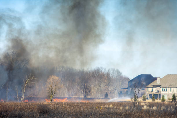 Toledo, OH, USA - July 2, 2006: Firefighters at a house fire in the suburbs of Toledo, Ohio