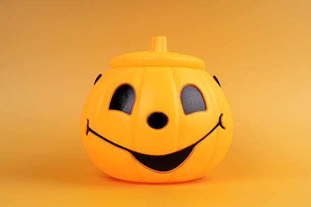 Halloween pumpkin on orange background
