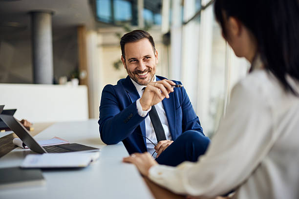 Professional Businessman Discussing Ideas During a Meeting in a Modern Office Space stock photo