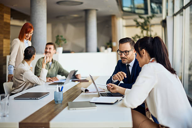 istock Collaborative Business Team Meeting in Modern Office with Digital Tools 2206511254