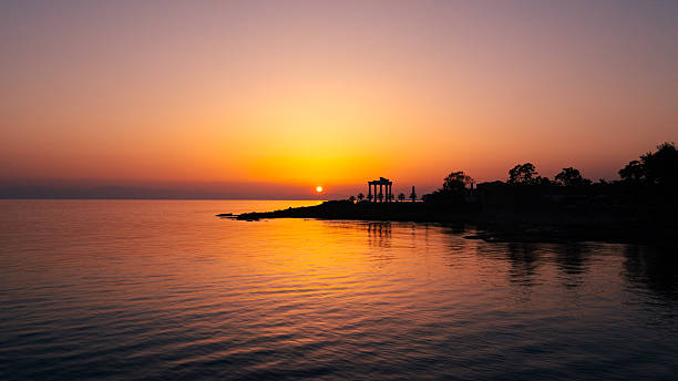 Mediterranean atmosphere towards sunrise on the Phaselis coastline. The morning glow of sunrise on the horizon