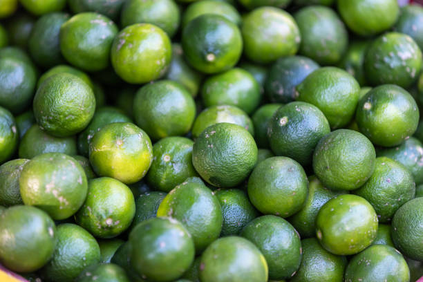 Organic limes on local market stand.