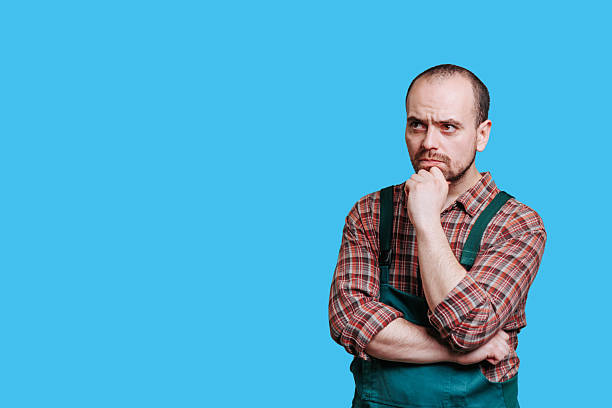 istock Thoughtful man in work attire pondering his next move in bright setting 2206518079