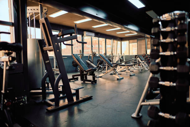 istock Empty gym with exercise equipment waiting for athletes 2206518441