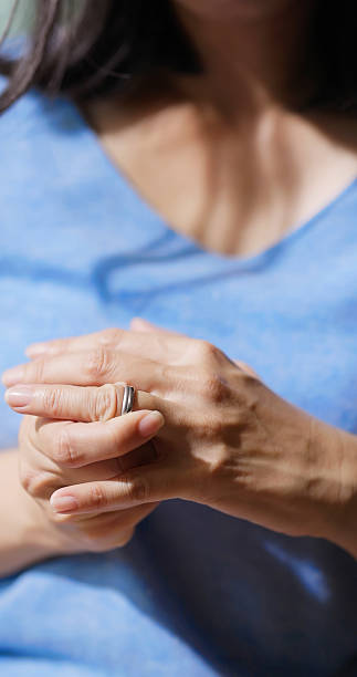 istock woman removing her wedding ring 2206519767