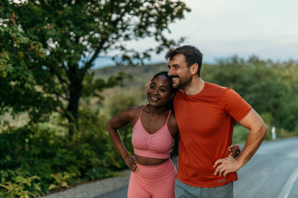 istock Happy multi-ethnic couple taking a break during their outdoor workout 2206521029