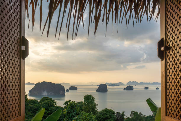 istock Tropical Island View from Open Window at Sunset 2206522474