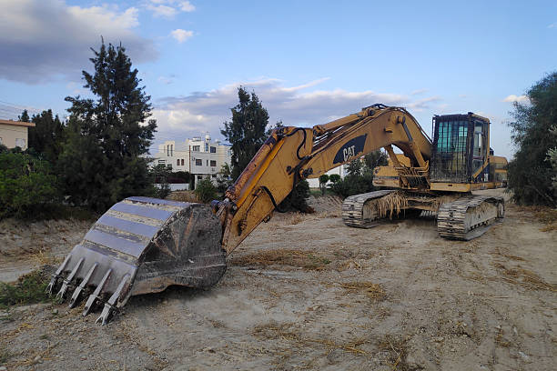 Cairo, Egypt, September 6 2025: demolition hydraulic crawler excavators and vehicles after placement of water pipe parts in place, sanitation pipes, improvement of infrastructure