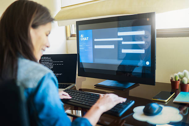 AI chat bot, Programmer using generative artificial intelligence for interface development on computer, Virtual chatBot technology trend stock photo