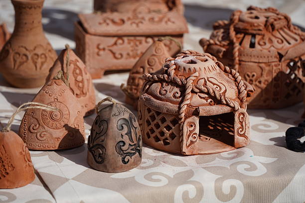 Traditional Indian handmade Items of Earthenware Or Ceramic at a Vendor Stall, decorative Sculpture Made with Earthen Mud, handcrafted traditional clay decoration toy in indian market