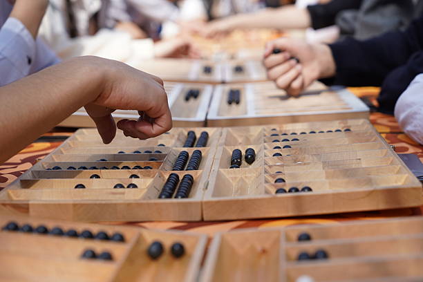 The Kazakh traditional board game is togyz kumalak.