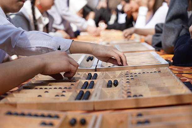 The Kazakh traditional board game is togyz kumalak.