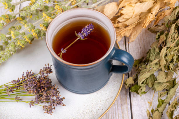 istock Green tea or herbal tea with cup, sugar lavender and dry herbs 2206529212
