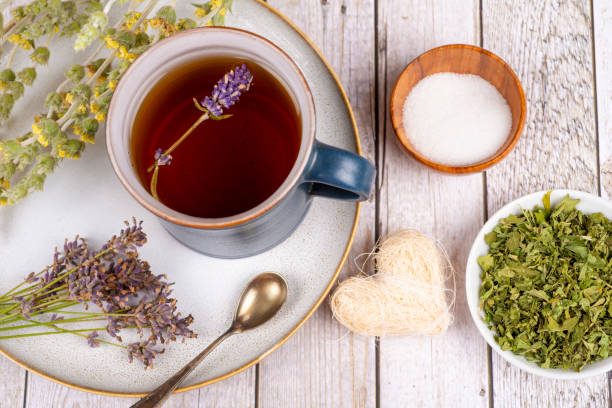 istock Green tea or herbal tea with cup, sugar lavender and dry herbs 2206529234
