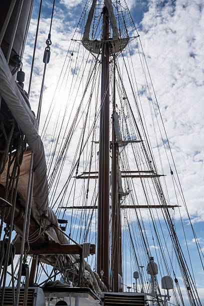 istock A large ship with a tall mast and a sail. 2206533856
