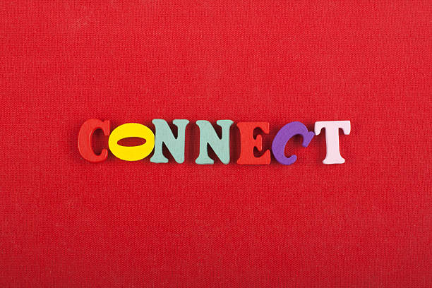 Word on red background composed from colorful abc alphabet block wooden letters, copy space for ad text. Learning english concept