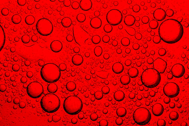 istock Macro drink bubbles,red macro bubbles,Backgrounds, Abstract Backgrounds, Soda, Red, Carbonated,Beauty concept background. Closeup cosmetic liquid gel with bubbles on red colors background 2206535298