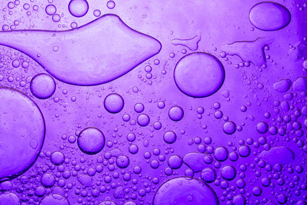 Purple macro bubble texture,Oil drops on a water surface, purple abstract macro background.