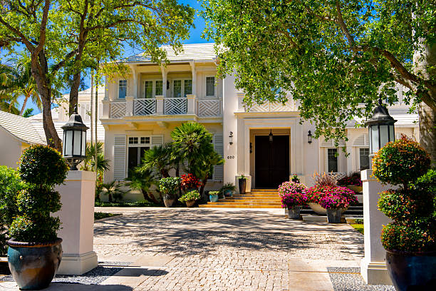 Extensive photographic coverage of a contemporary two-storey stone-clad residence, including exterior views, architectural details, landscaped yard, paved driveway, and the full interior layout. The interior series documents living areas, kitchen, dining room, bedrooms, bathrooms, hallways, basement, and structural details, illustrating the condition, design quality, and spatial organization of the property. The collection is suitable for editorial uses, real-estate documentation, architectural analysis, and property marketing.