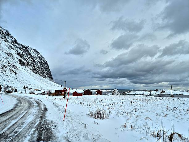 istock Lone road in the arctic during snow storm 2206536335