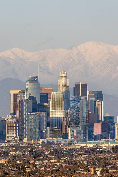 istock Los Angeles skyline with snow covered mountains in the distance 2206537321