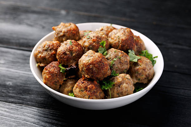 istock Homemade beef and pork meatballs on baking paper 2206538154