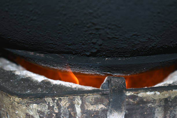 istock Close-up burning coal in a fire. Bright orange flame burning inside 2206538341