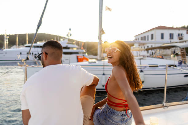 istock Romantic couple enjoying the sunset on a sailboat 2206539281