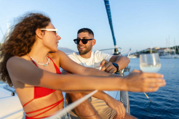 istock Romantic couple enjoying the sunset on a sailboat 2206539372