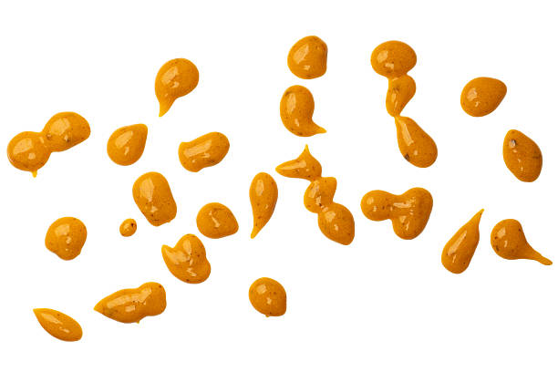 istock Yellow sauce splashes as a background. 2206540790