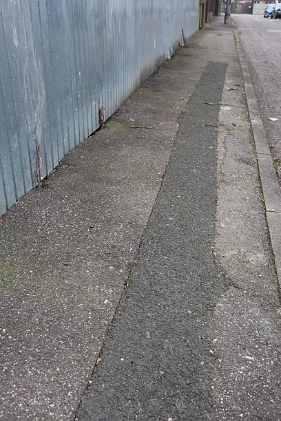 istock Degraded public road accession way 2206540839
