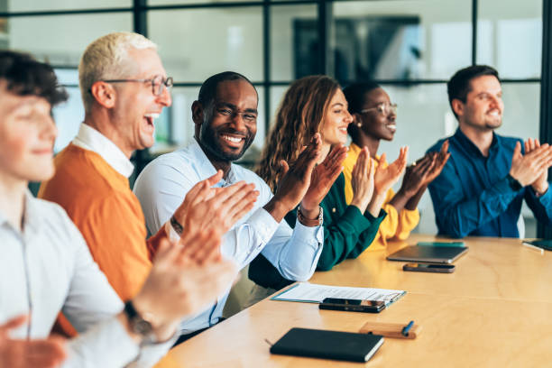 istock Diverse Team Applauding During a Business Presentation 2206543103