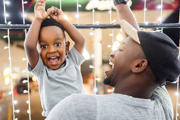 istock Father and son laughing together during christmas celebration 2206544487