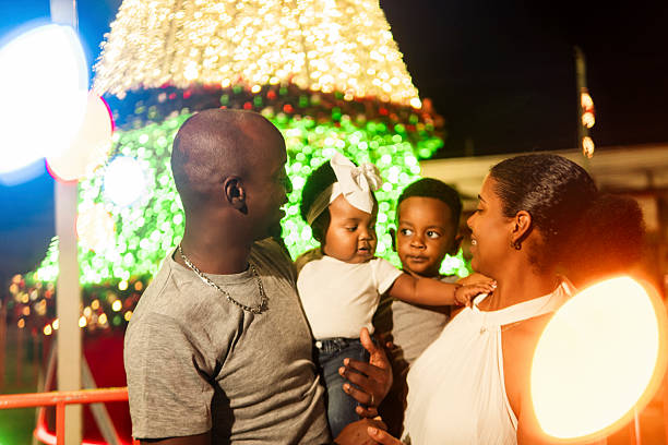 istock Family enjoying christmas lights at night 2206544604