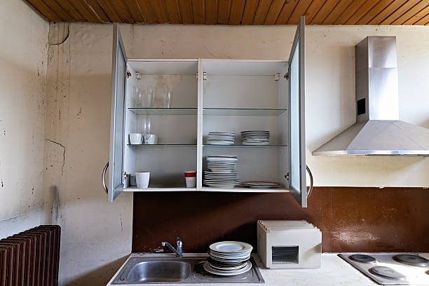 istock Lost Place, old, partially destroyed kitchen with furniture 2206548000