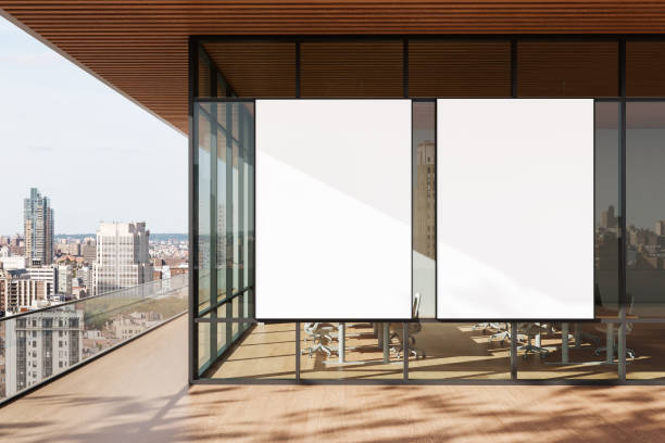 istock Modern Office Interior with Blank Posters on Glass Wall. 3D Rendering 2206550454