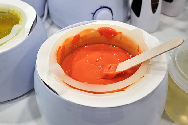 istock Many electrical hot bowls with wax for epilation of different colors and compositions. 2206550711